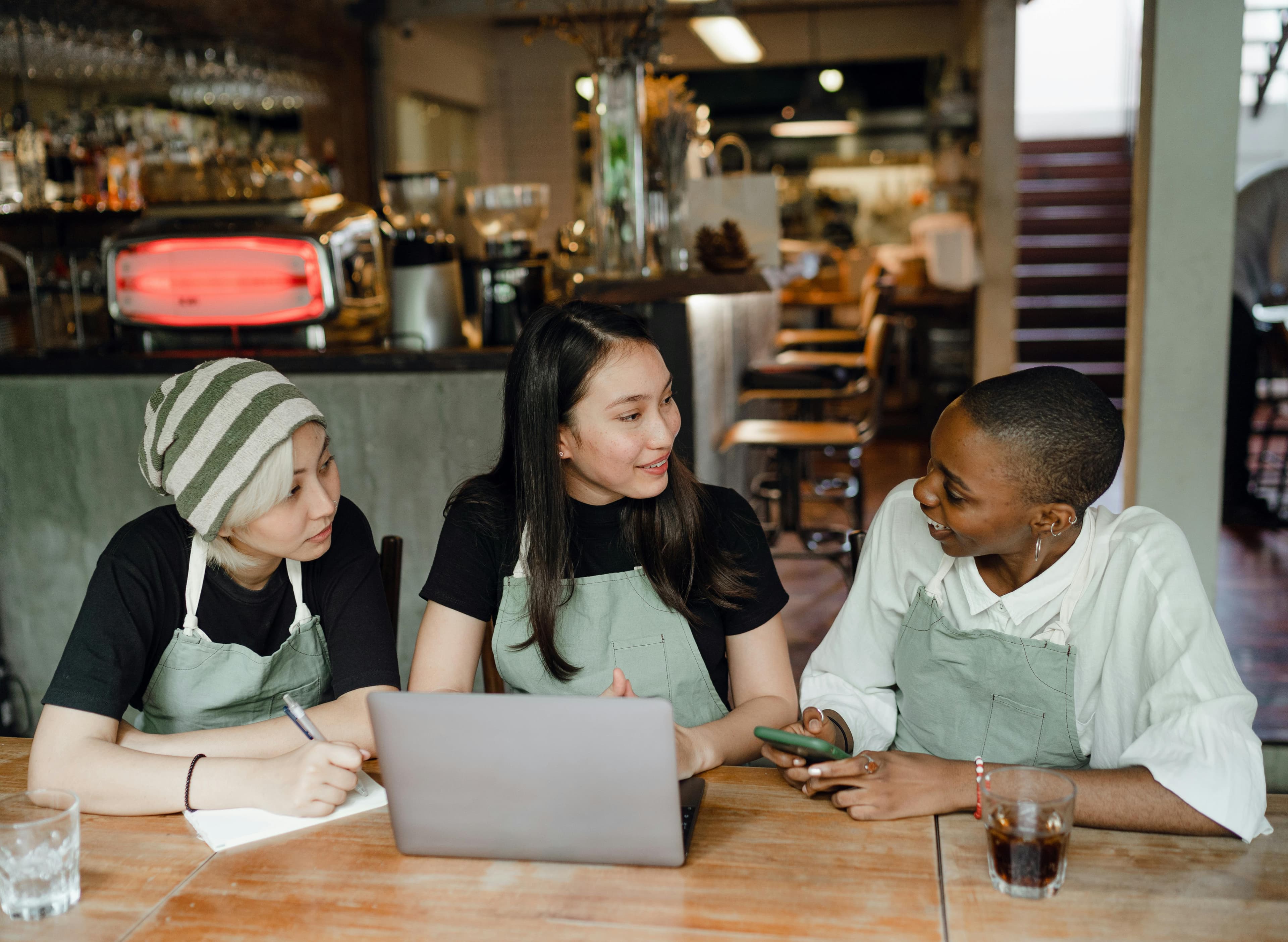 Restaurant owner setting up on laptop